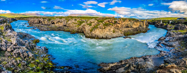 Godafoss waterfall with colorful sunset sky in summer at Iceland