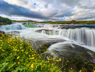 Aerial drone view of Fosslaug waterfall, Iceland