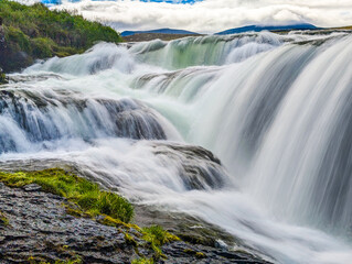 Aerial drone view of Fosslaug waterfall, Iceland