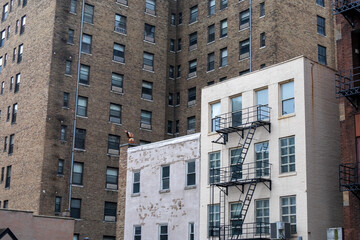 small building in big city