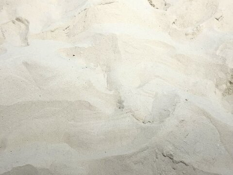 A pile of sea sand with a natural brownish white color as a background material for 3d max rendering software