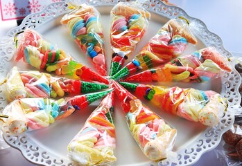 Packaged sweet treats arranged like pizza slices on a plate dated June 21, 2025