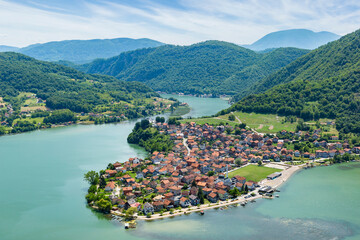 The small town of Divic in Bosnia on the bank of the Drina River, surrounded by the Balkan Mountains