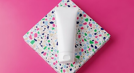 Tube Mockup on Terrazzo Pattern Surface with Pink Background