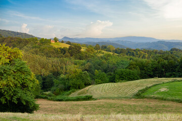Landscape with low mountains in western Serbia. Summer evening.
