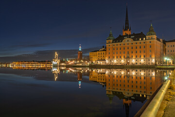 Night view of AF Chapman ship and Riddarholmen in Stockholm with reflections