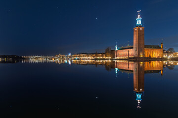 Stockholm City Hall beautifully illuminated and reflected at night