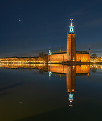 Stockholm City Hall beautifully illuminated and reflected at night