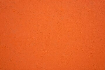 Vibrant orange and red grunge wall textures create a vintage, aged backdrop with a rough, patterned surface
