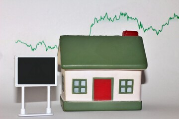 House model with the price chart as background and a space for text .