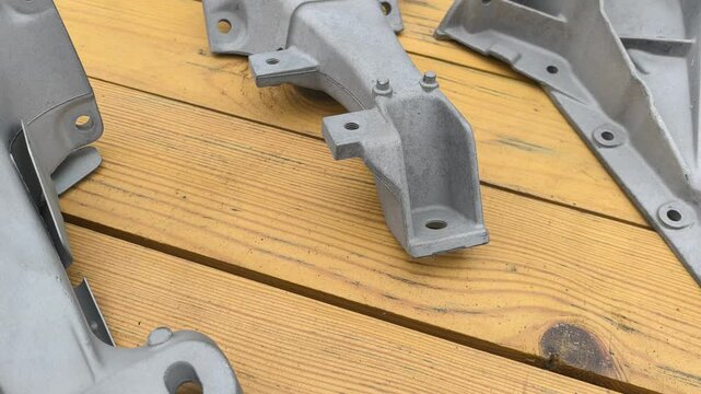 Witness the sandblasting treatment on automotive parts showcasing the preparation for a smooth surface finish. This process is essential before applying coatings.