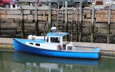 Old blue fishing boat at Maine downtown marina