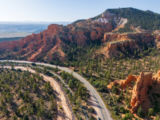 Scenic Byway in Southern Utah Toward Bryce Canyon National Park With Towering Sandstone Cliffs and Red Stone Tunnels Drone Photography