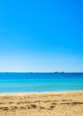 Rockingham, WA  Australia - 08312022 Rockingham foreshore makeover with colourful umbrellas and seats, next to the beautiful blue Indian Ocean.