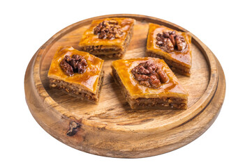 Arabic Traditional Honey Walnut Baklava on wooden board isolated on white background. top view