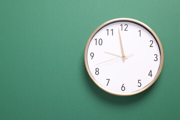 Close-up of a wall clock. The concept of time and work time is valuable for life, Alarm clock...