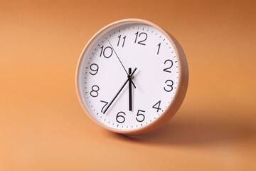 Close-up of a wall clock. The concept of time and work time is valuable for life, Alarm clock...