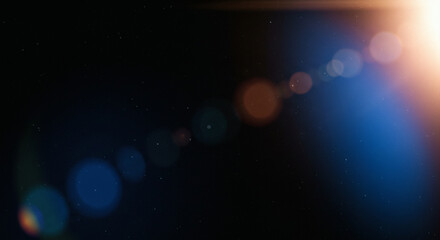 Blue light leaks and gradient over an abstract grainy background. Grainy colorful warm blue light leaks on a black background with a dust texture. Blue wavy abstract background for presentation	