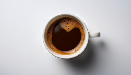 top down shot of a mug of coffee against a white backdrop