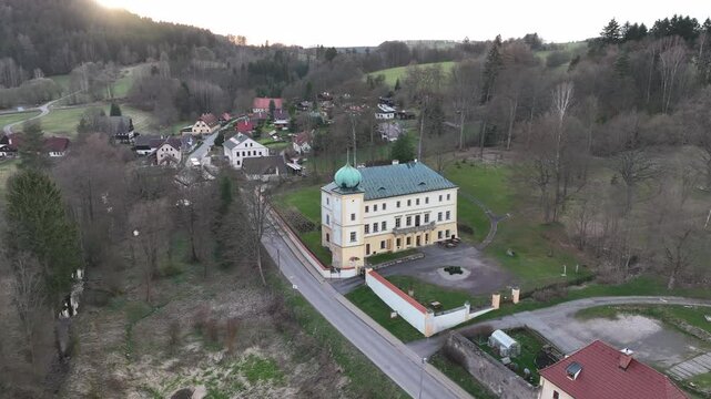 Drone view of Adersbach Manor, known as Adrspach Chateau, nestled in the scenic landscape