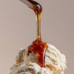 Delicious ice cream topped with warm sweet syrup dripping down on a soft surface in a cozy setting