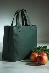 Dark green tote bag with apples and herbs