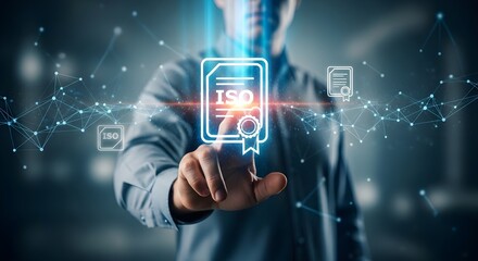 A person's hand interacts with a glowing digital ISO certification graphic. Modern technology and global standards.