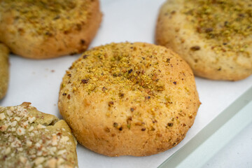 Close-up of multiple sesame-seasoned savory biscuits displayed on a tray