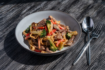 Pasta with beef, mushrooms and vegetables. 