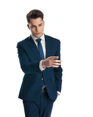 attractive elegant man in navy blue suit pointing finger away