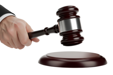 A hand in a suit sleeve holds a wooden and silver gavel above its striking block, isolated on white, signifying legal proceedings on transparent background
