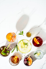 Alcohol cocktail drinks at white background.