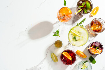 Alcohol cocktail drinks at white background.