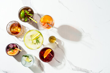 Alcohol cocktail drinks at white background.