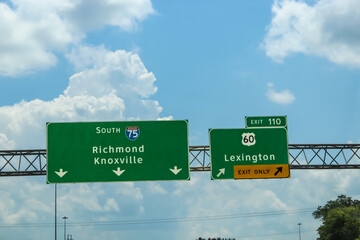 USA travel background with copy space. Interstate highway sign. Interstate 75 South and US-60. Richmond, Knoxville, and Lexington. Passenger view design element or transportation theme banner. © mailcaroline