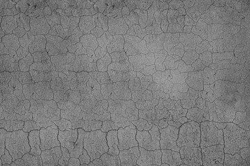 Long winding crack in the wall. Cracked concrete surface covered with gray cement mortar. Destruction after the earthquake. Copy space. Repair, construction of grey gray beige buildings