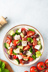 Greek salad, healthy food, mediterranean diet. Fresh vegetables, cheese and olive oil with spices.