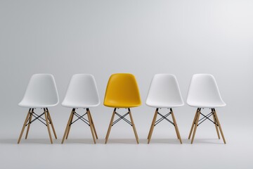 Modern minimalist chairs with single yellow accent in bright space