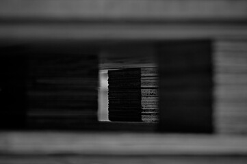The space inside the wooden pallet was photographed, black and white photography enhances the abstract content of the image, simple natural abstraction