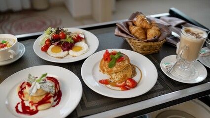 Delicious breakfast being served on a tray in hotel room