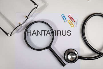 Hantavirus Alert Paper with Magnifying Glass on Doctor’s Desk – Medical Surveillance Scene