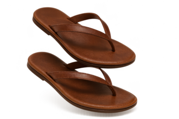 Pair of brown leather flip flops isolated on a transparent background studio shot