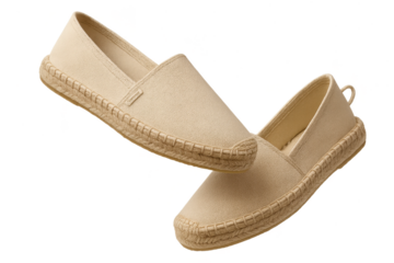 Beige espadrilles stacked and isolated on a transparent background for design