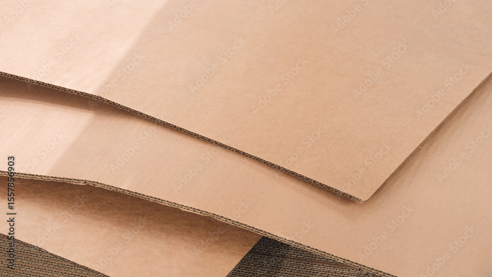 Poster Brown cardboard sheets for packaging is neatly placed in a stack for further use as background for template pages and banners delivery logistics concept