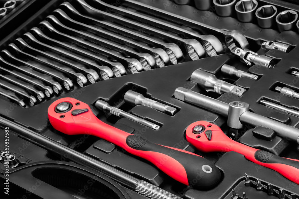 Poster A toolbox with many different tools including pliers, wrenches, and screwdrivers. The tools are organized in a way that makes it easy to find what you need