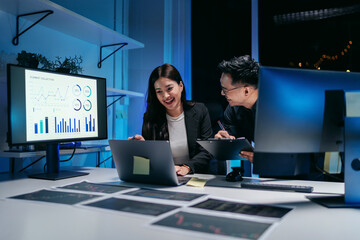 Business professionals collaborating on market analysis and AI driven data insights during focused late night office work