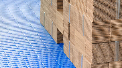 Elements of corton boxes are collected in stack. Conveyor line for the production of boxes. Machine...