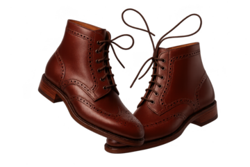 Elegant brown leather lace-up boots isolated on transparent background studio shot