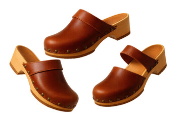 Three brown leather clogs isolated on a transparent background, studio shot