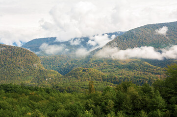Autumn Mountain Landscape with Green Fields and Grassy Foothills